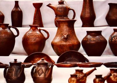 A collection of handcrafted clay vases and pottery showcasing intricate designs.